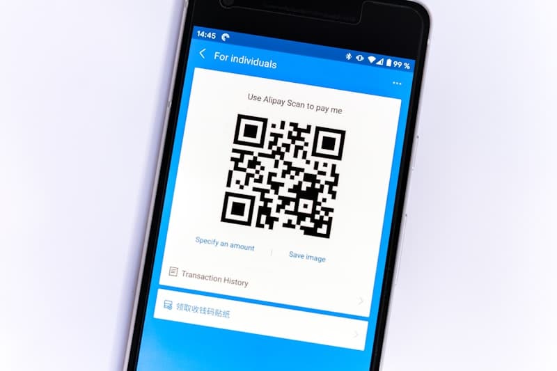 Driver scanning vehicle QR code with phone for instant checkout